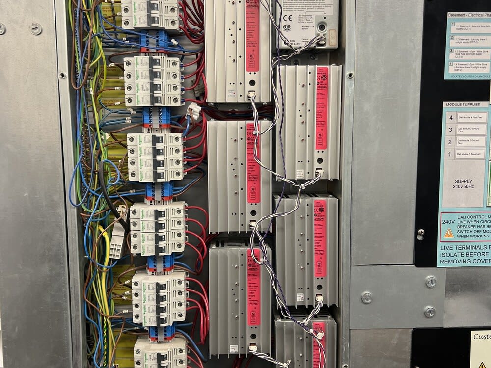 Certified electrician performing a Commercial EICR inspection to ensure electrical safety in a business premises