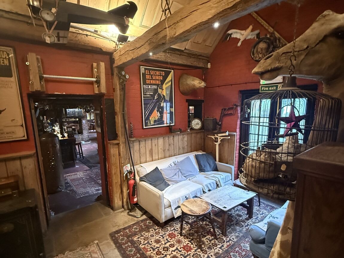 Interior of a Winchester pub with exposed beams and seating