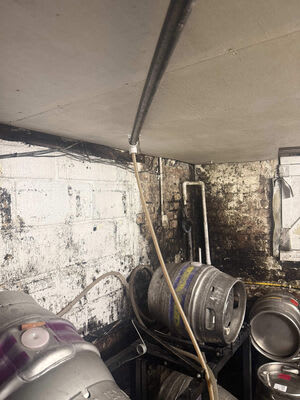 Existing wiring and equipment within the cellar before the rewire.