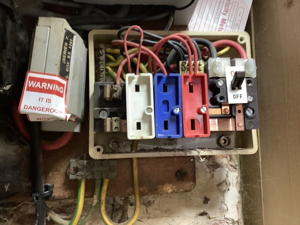 Close-up of older fuse equipment inspected at the Winchester pub before its rewire