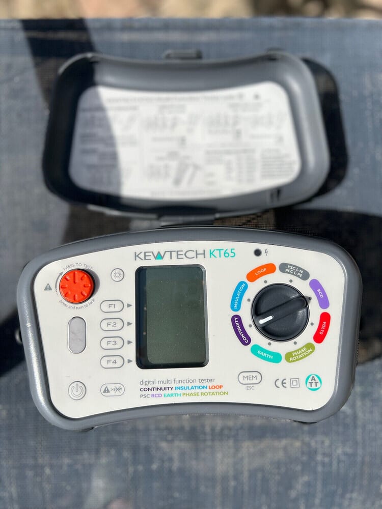 Qualified electrician conducting an Electrical Installation Condition Report (EICR) inspection in a property in Winchester