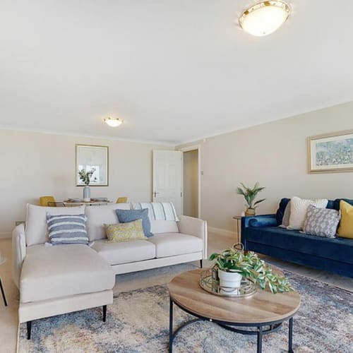 Styled 2 bedroom apartment in coastal Folkestone by Farrow Home Staging, using neutral tones and hints of blue and greens  