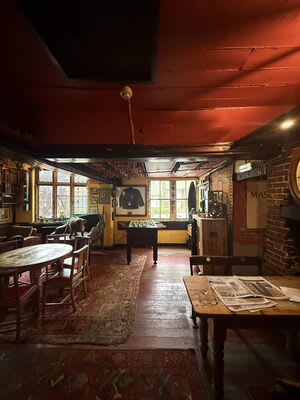 Lighting across a larger public area of the pub.