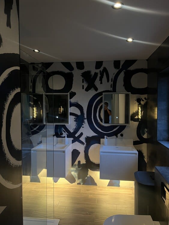 Under-cabinet LED tape lighting in a contemporary Bathroom.