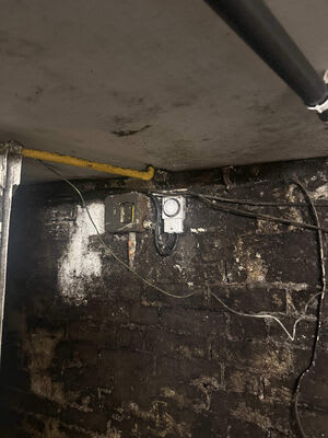 A wider view of the older switch and timer in the cellar before the rewire.