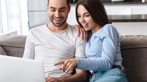 couples looking at baby scans