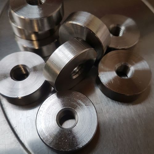 Round internally threaded nuts