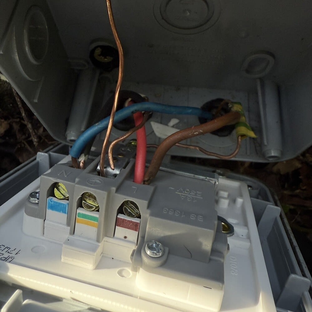 Electrician carrying out EICR test on a domestic consumer unit with RCD protection