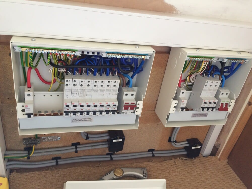 Certified local electrician in Southampton repairing a domestic fuse board.