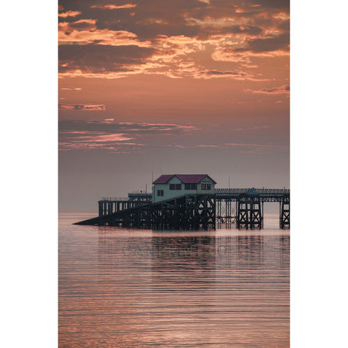 Pink sky and calm sea at Mumbles