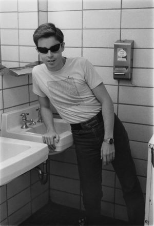 Bob, leaning against a sink, wearing cool sunglasses.
