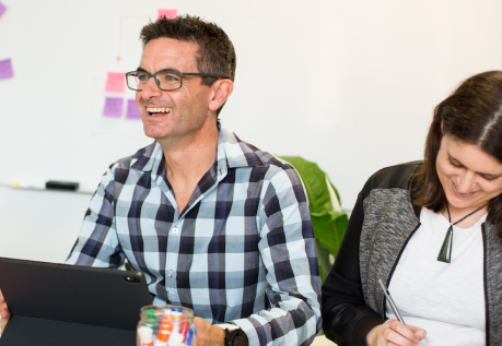 Founders, Tim and Katie, laughing