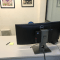 tiny pc mounted on the rear of a monitor