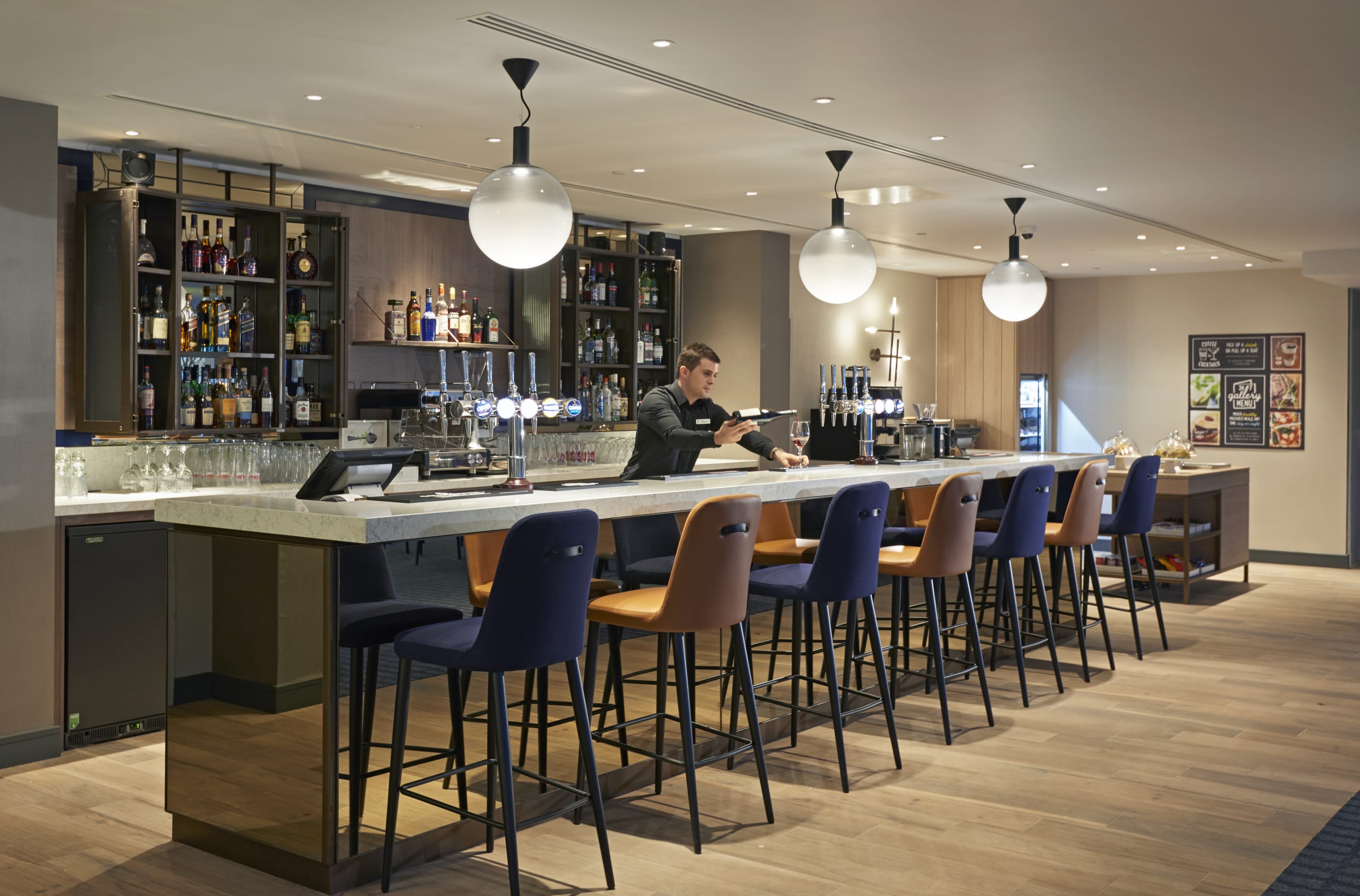 Hyatt Place London Heathrow Airport P024 Interior Coffee to Cocktails Bar With Host