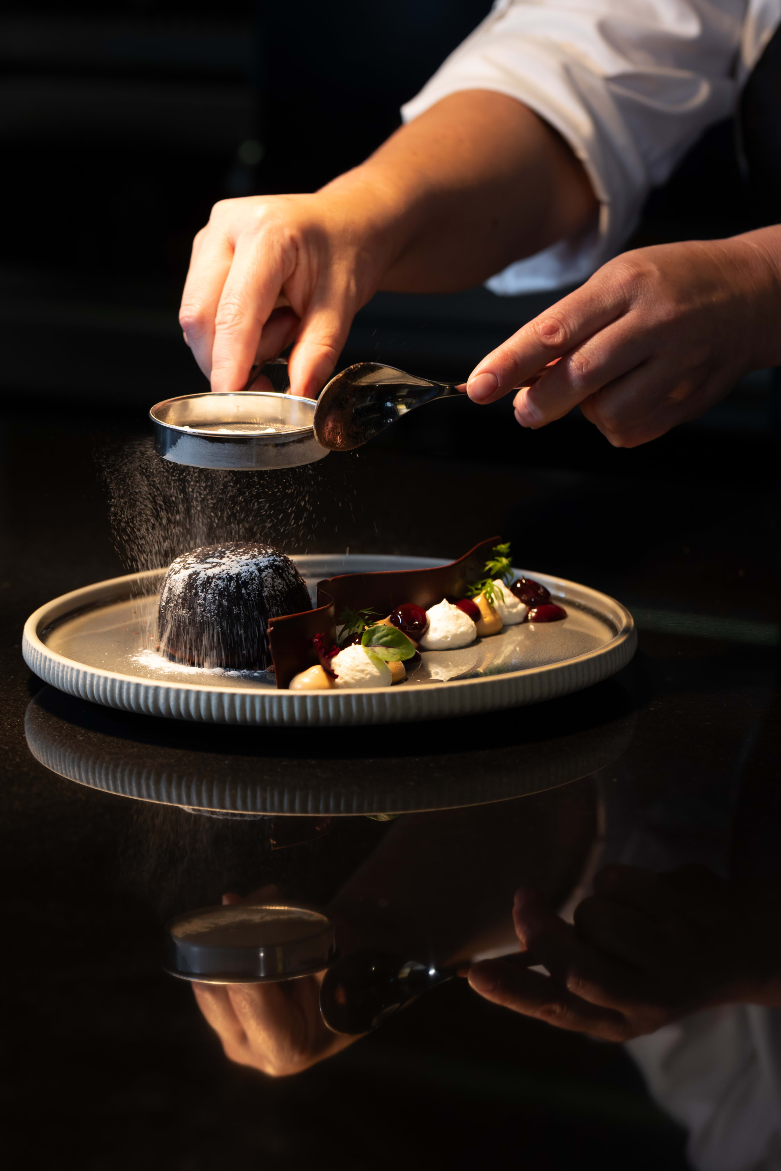 Dusting Cocoa Powder on Chocolate Fondant