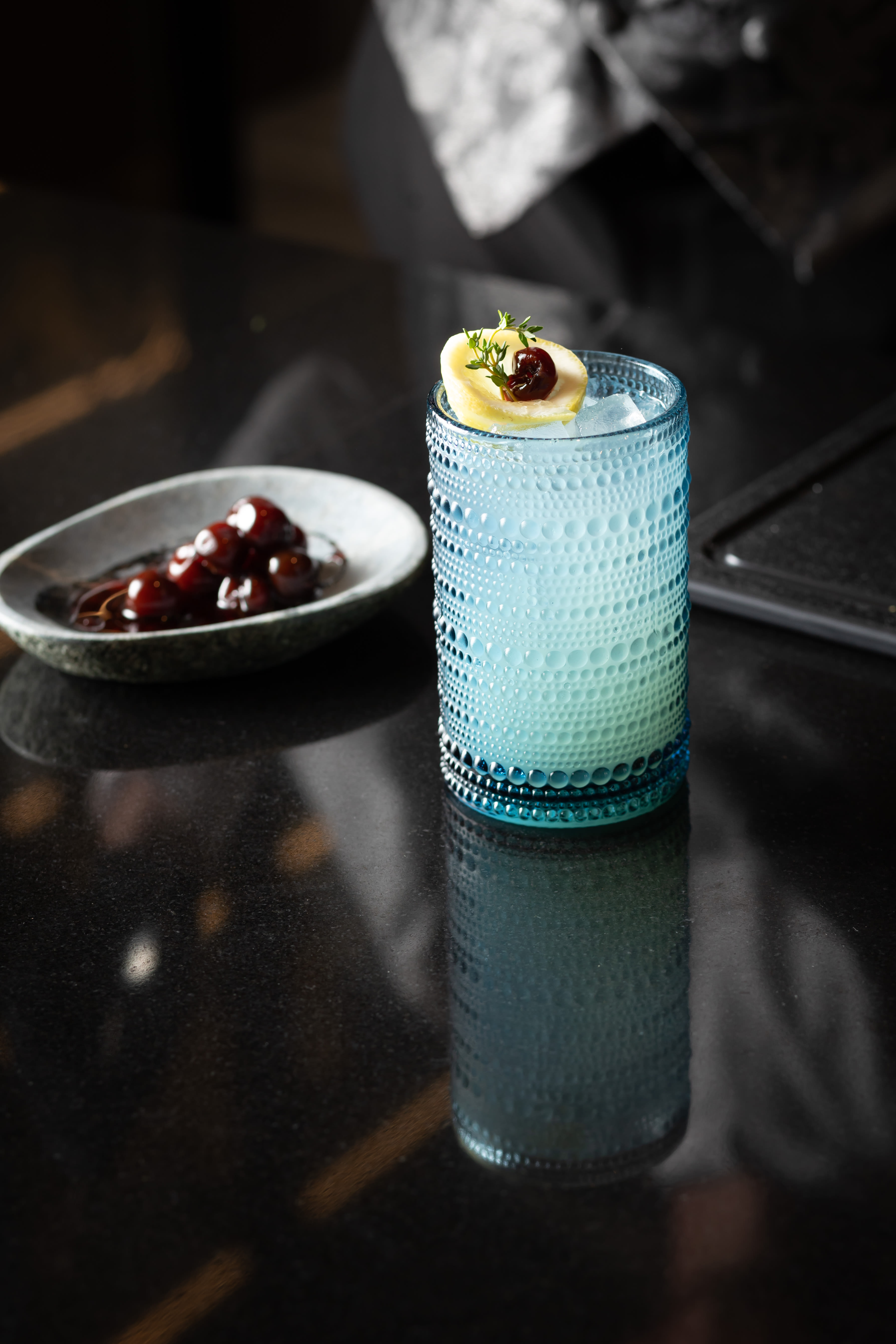Signature Cocktail With Cherry and Lime