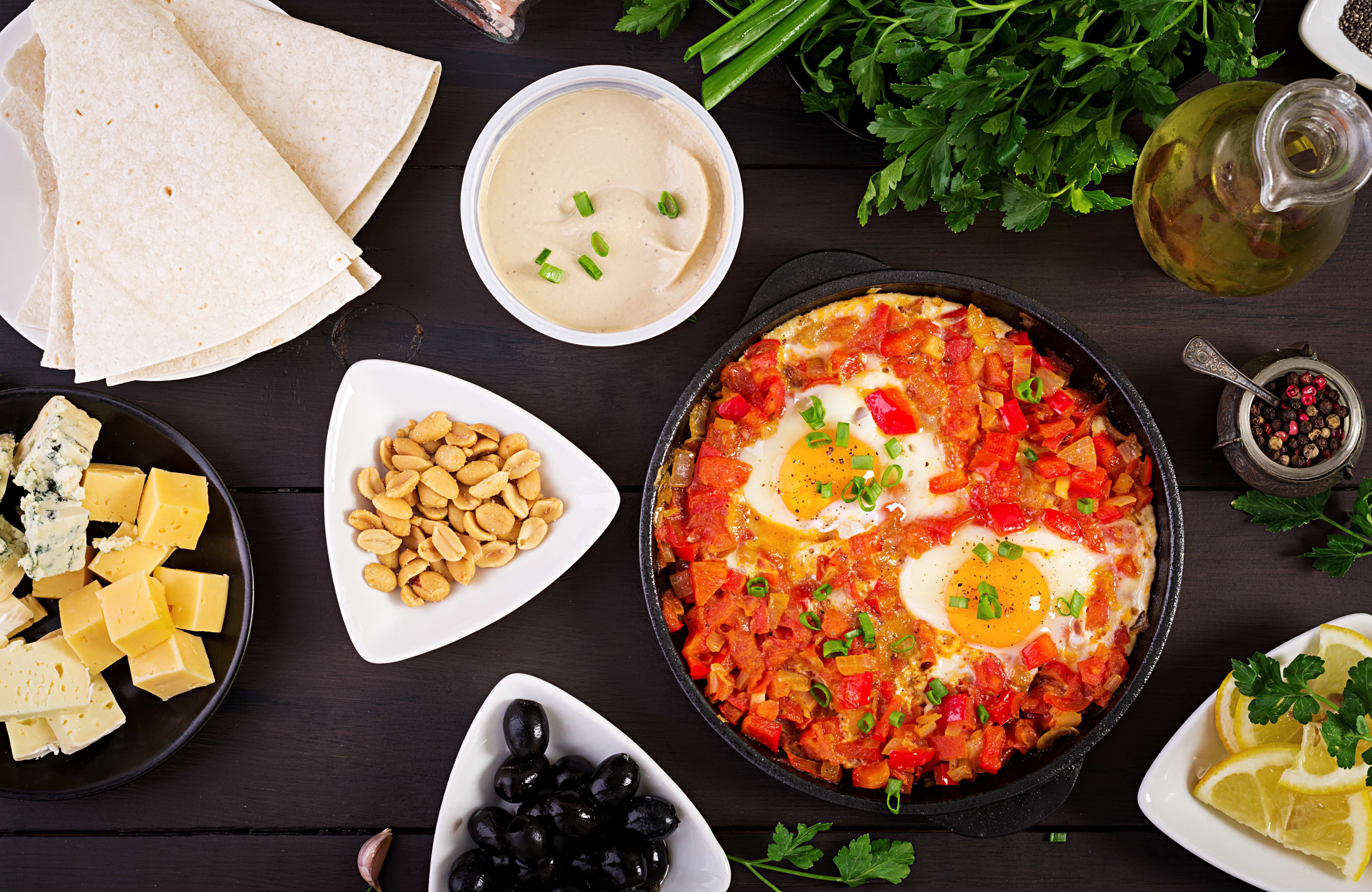 Turkish Breakfast Shakshuka Olives Cheese Fruit Rich Brunch