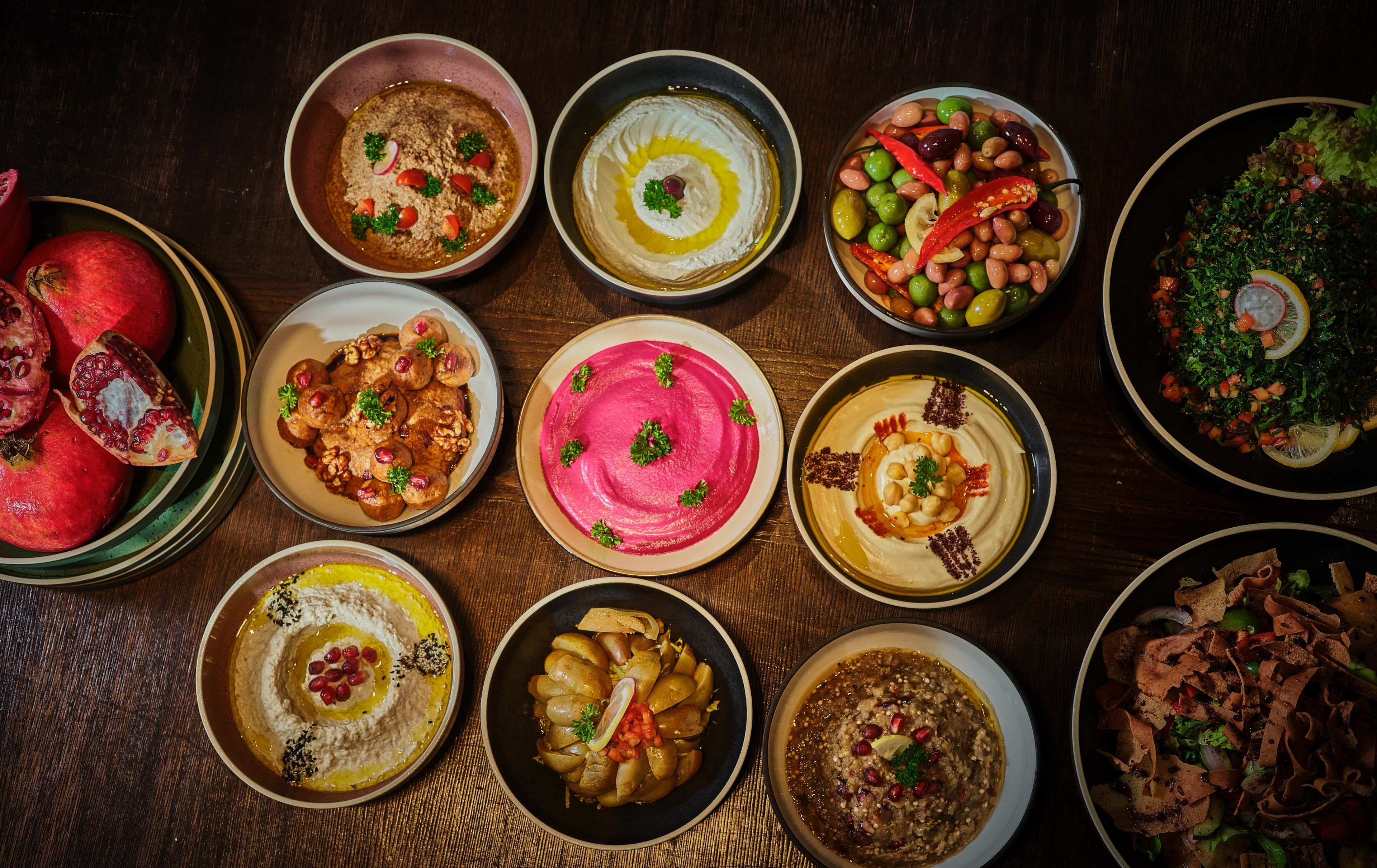 Imgcompressors Global P1810 Mezze Selection Buffet of Hummus Pomegranate and Olives