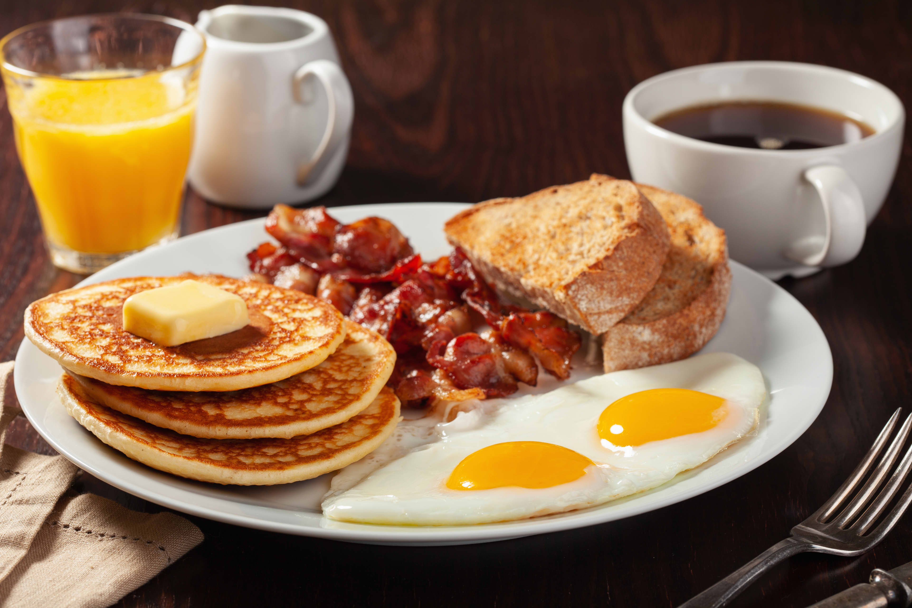 Traditional Full American Breakfast Eggs Pancakes With Bacon Toast