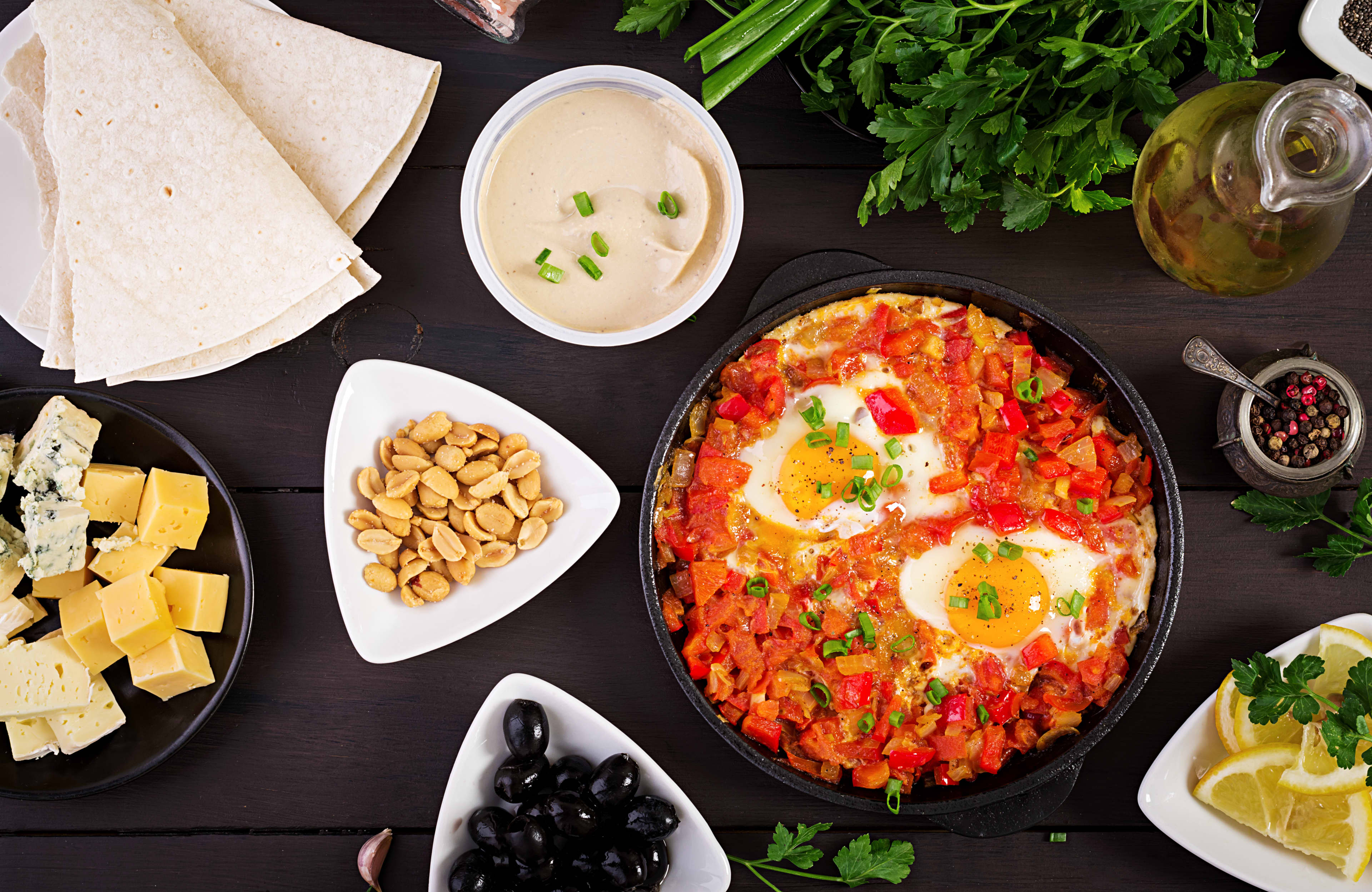 Turkish Breakfast Shakshuka Olives Cheese Fruit Rich Brunch
