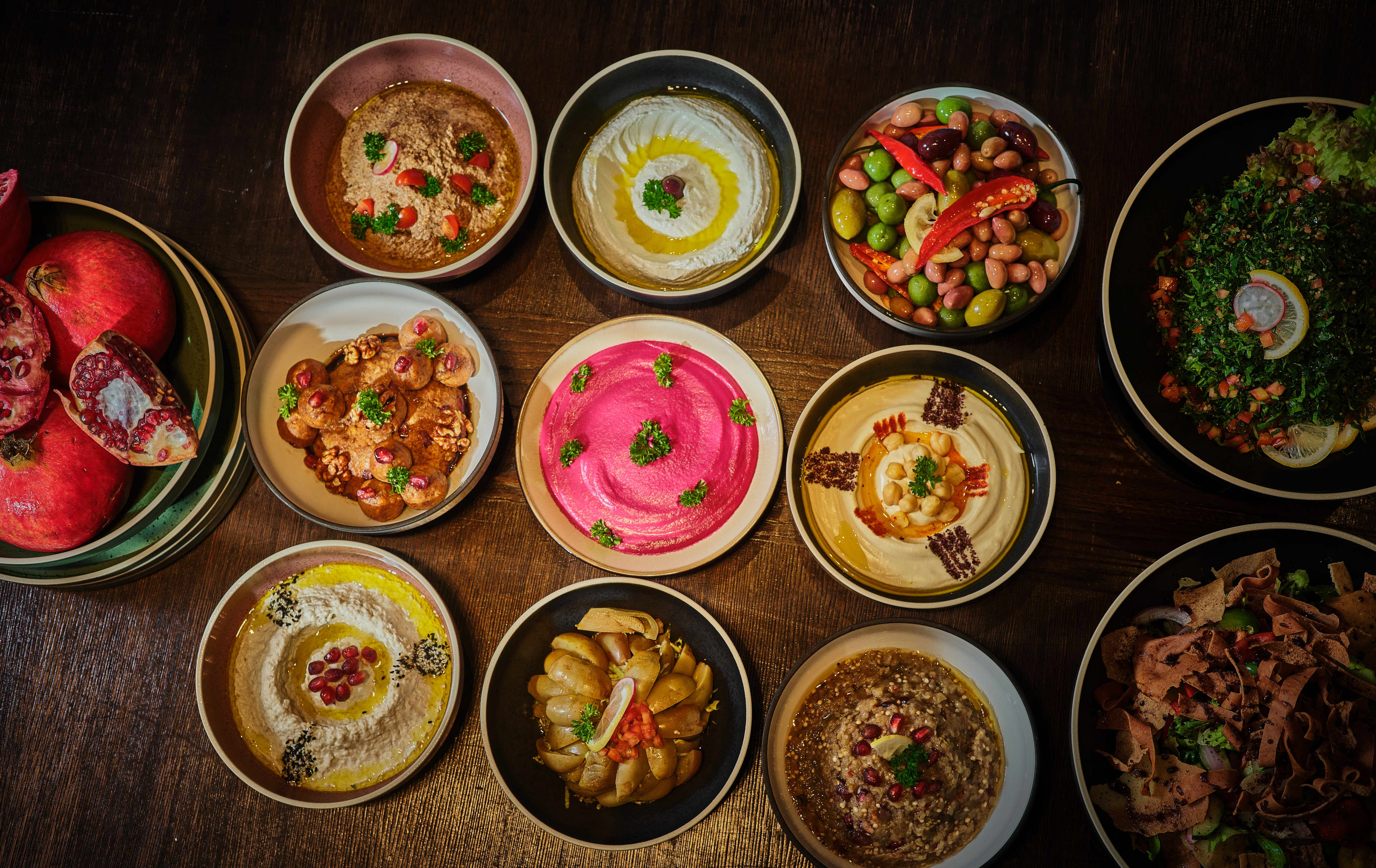 Imgcompressors Global P1810 Mezze Selection Buffet of Hummus Pomegranate and Olives