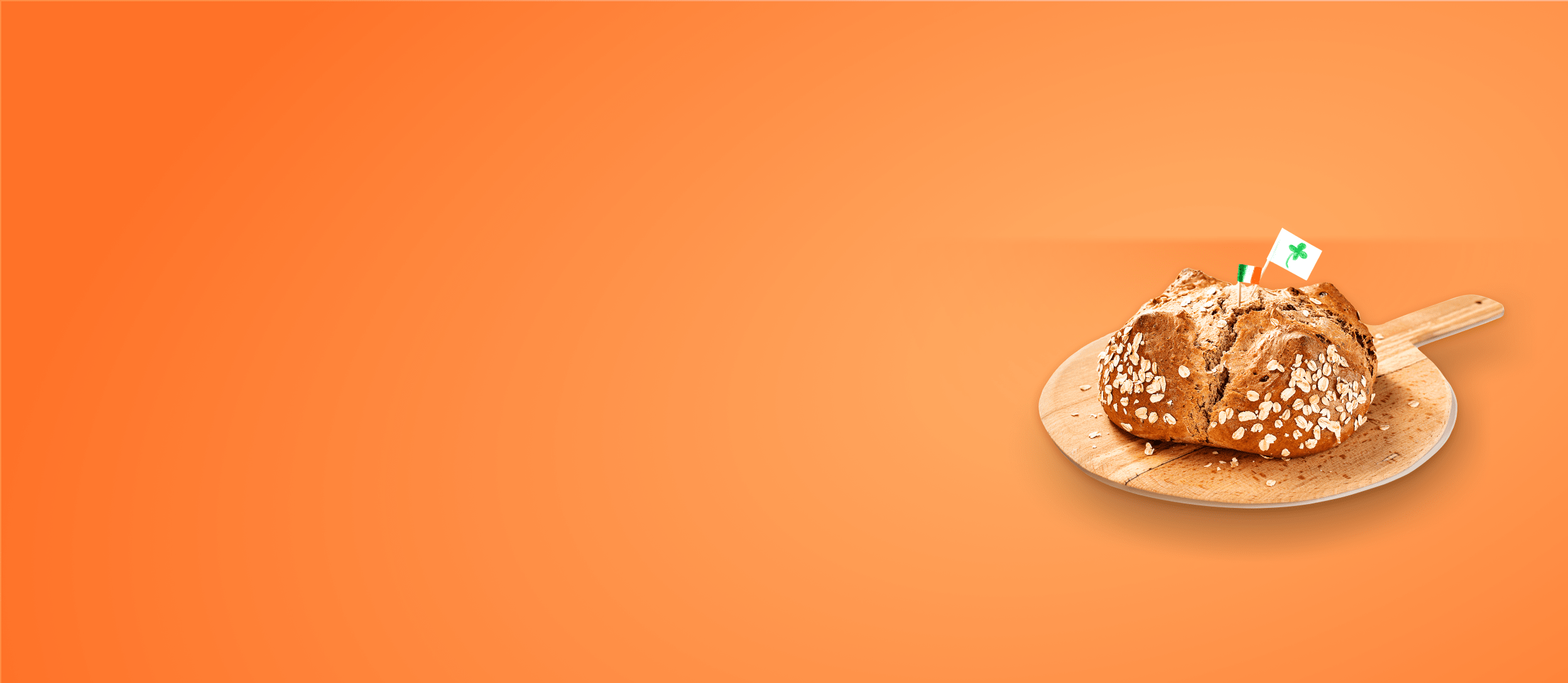 Freshly baked Irish soda bread on a wooden paddle (large)