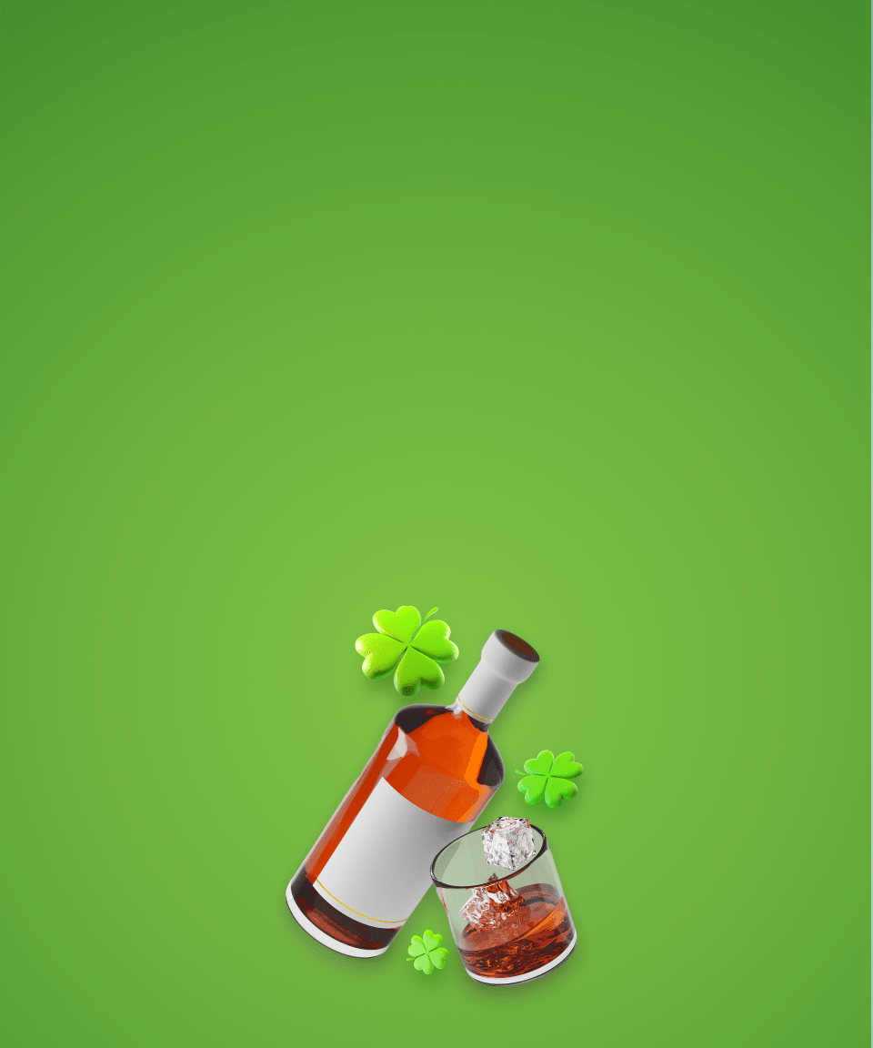 Bottle of Irish whiskey, glass of whiskey with ice, and four leaf clovers against a green background (small size)
