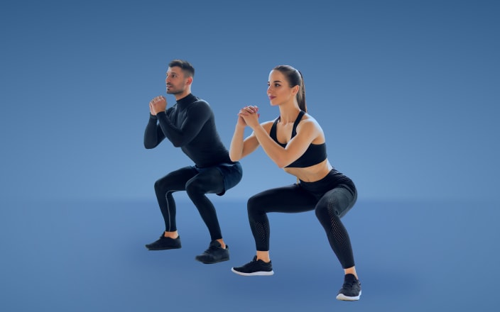 Two people dressed in athletic wear doing a squat for Confetti's Virtual Bootcamp Class