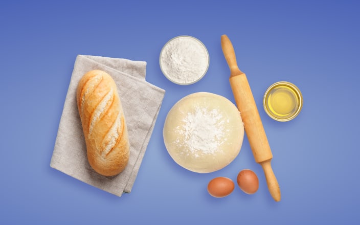 Loaf of bread, dough, oil, flour, eggs, and a rolling pin (preview)