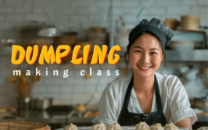 Smiling woman wearing an apron in a kitchen with the text 'Dumpling Making Class'