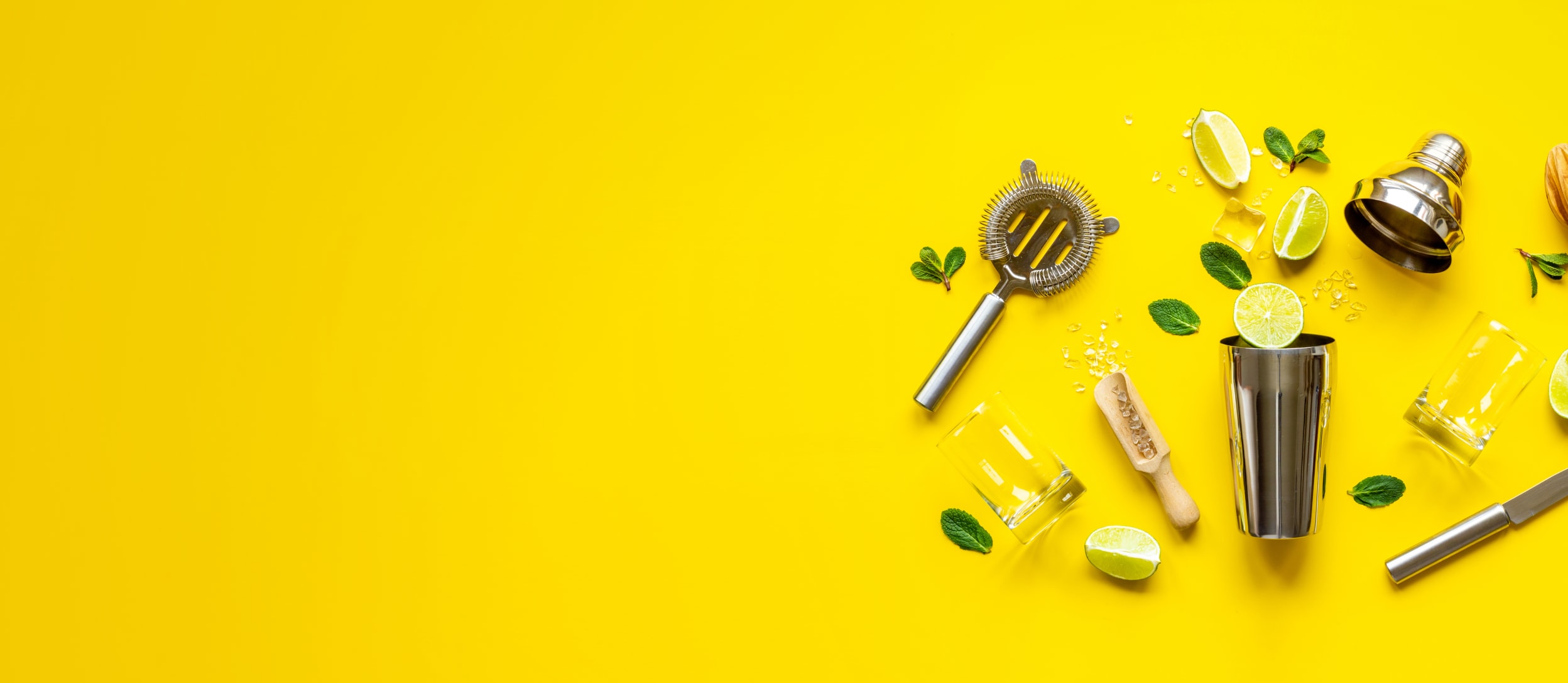 Supplies for a Cocktail Class, including bar tools, cocktail ingredients, and glass (large)