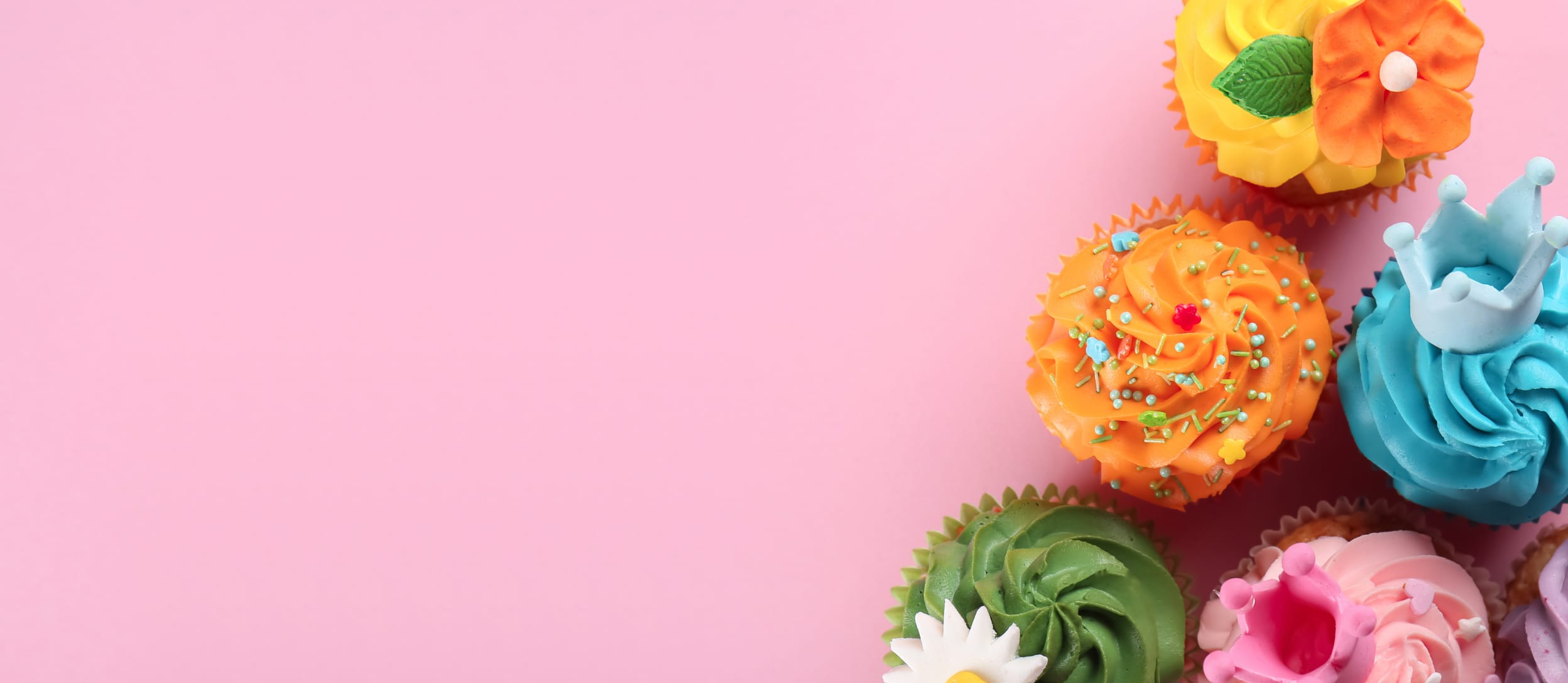 Decorated cupcakes against a pink background (large)