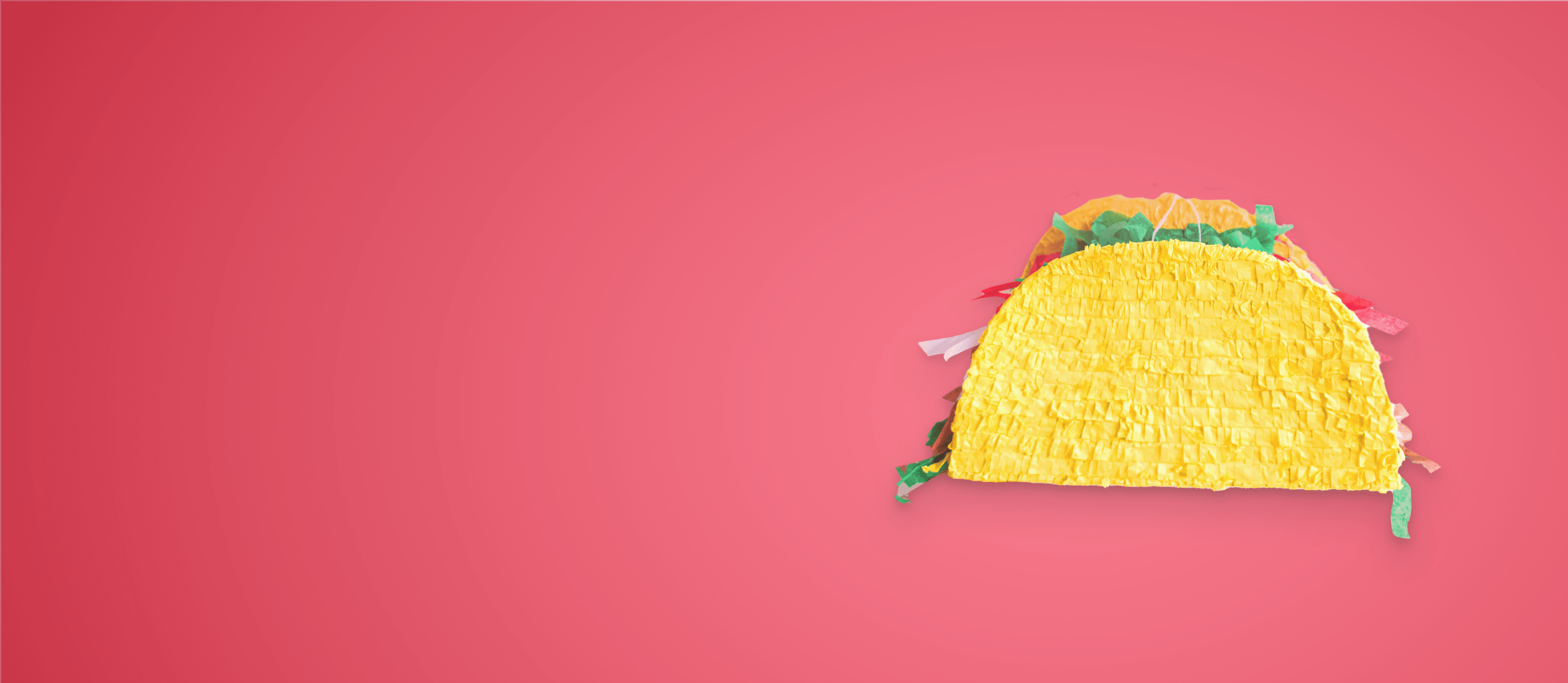 A taco shaped piñata for Confetti's Virtual Piñata Making Class