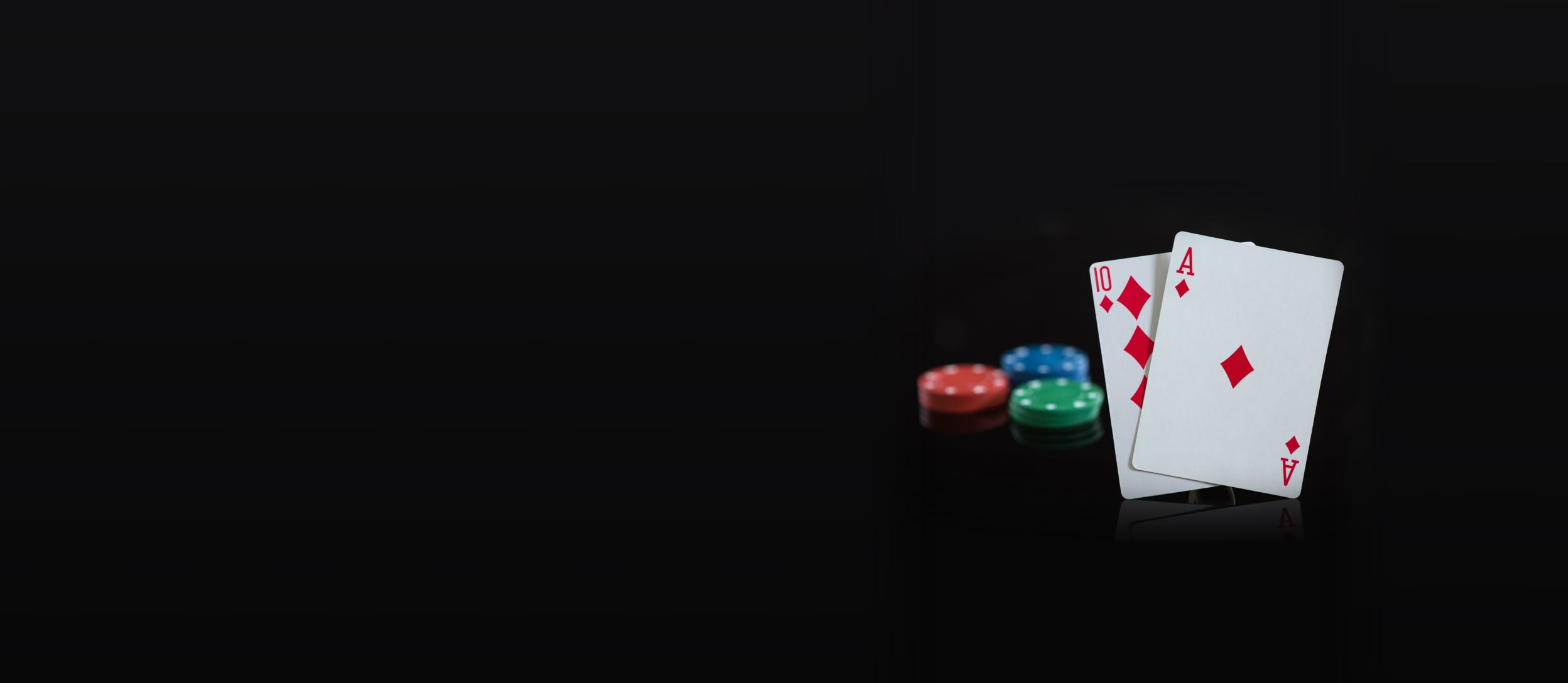 three stacks of poker chips and two cards hitting blackjack for Confetti's Virtual Corporate Casino Night 