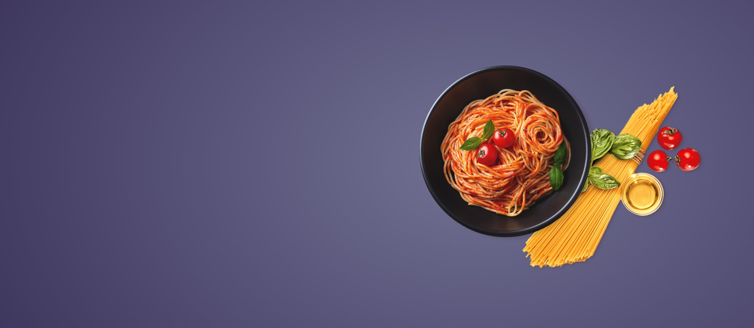 A plate of spaghetti next to a bundle of pasta, basil, and tomatoes for Confetti's Virtual In Home Cooking Classes