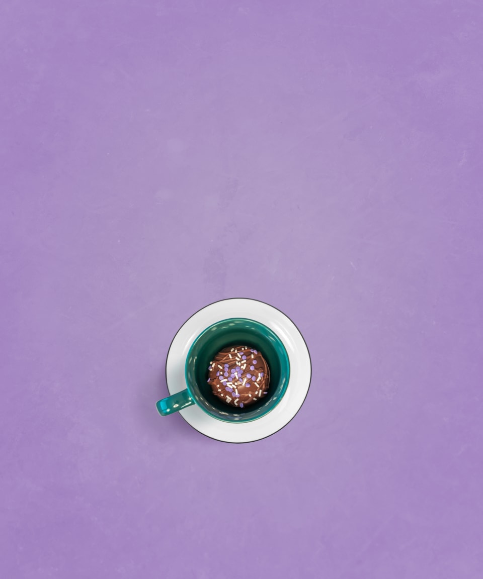 A birds eye view of chocolate topped with sprinkles in a mug for Confetti's Virtual Hot Chocolate Bomb Making Class 