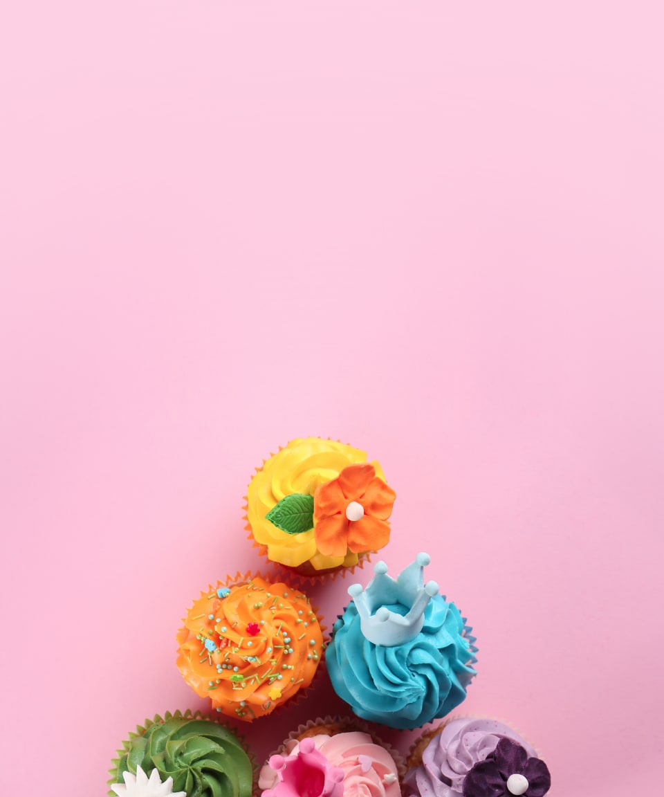 Decorated cupcakes against a pink background (small)