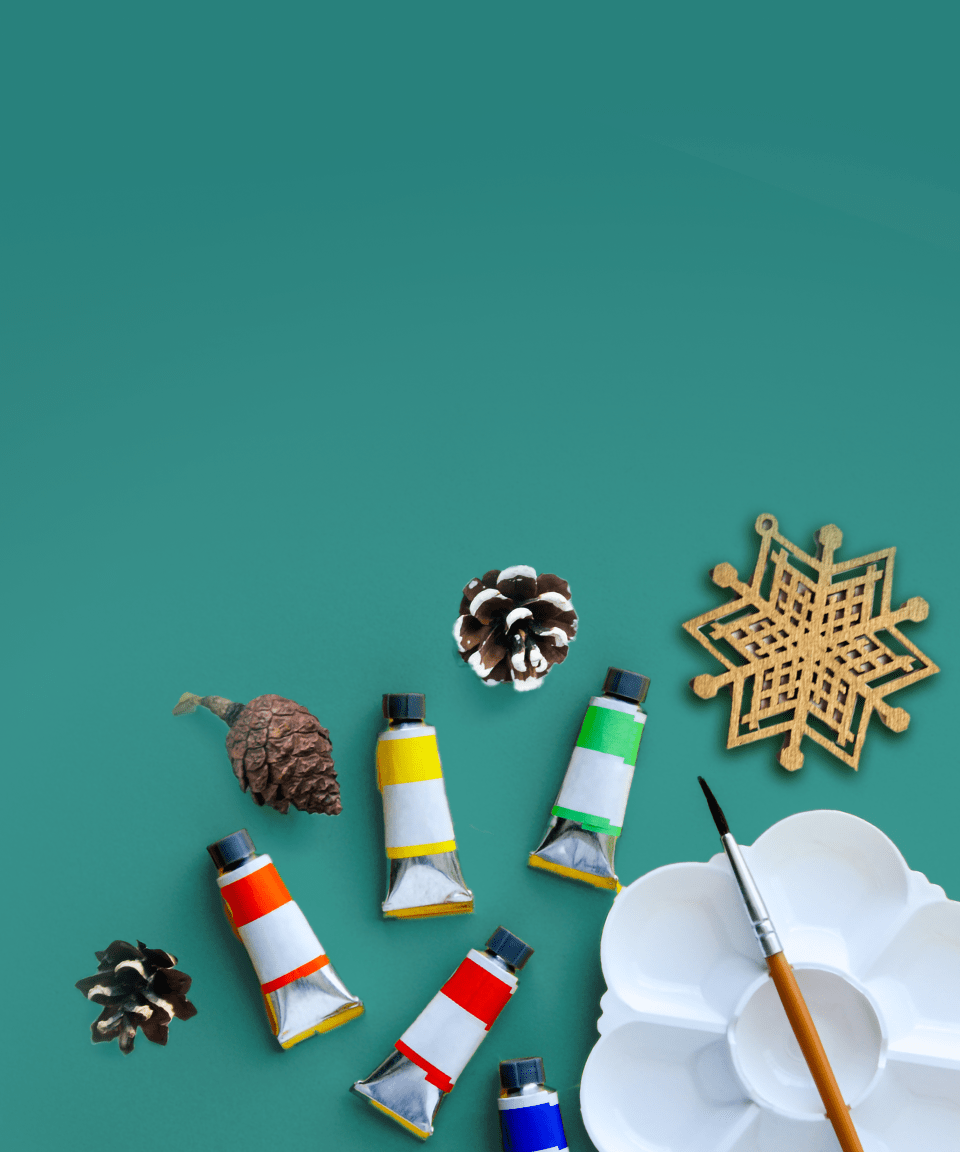 Tubes of paint, a palette, paintbrush, and festive winter holiday decorations (small)