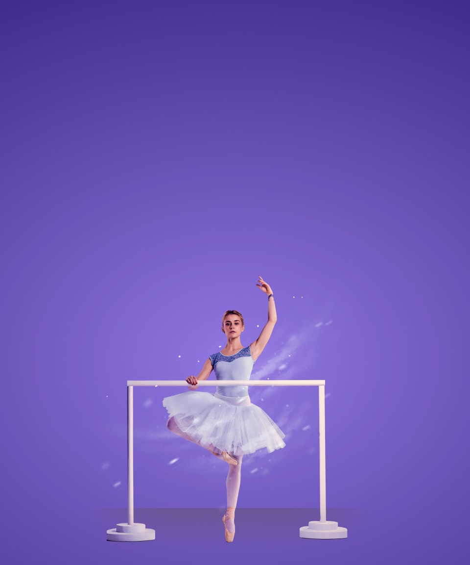 A winter ballerina in relevé at a ballet bar for Confetti's Team Building Dance Class (Small)