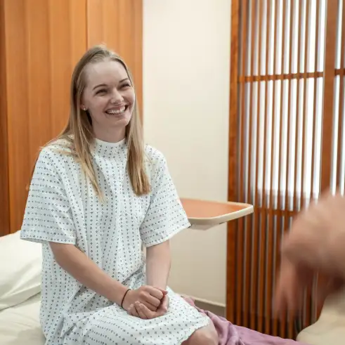 Patient in private pod, pre-op