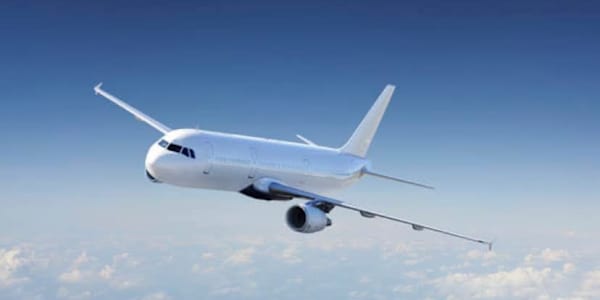 LEAVING ON A JET PLANE  Holly smooths her nurse’s uniform, exhaustion