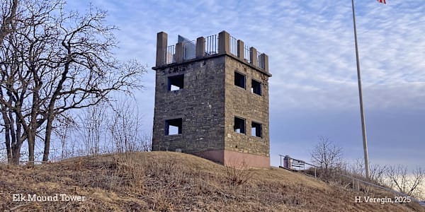 Oddsconsin 24 - Elk Mound Tower A rustic stone tower sits atop a hill on