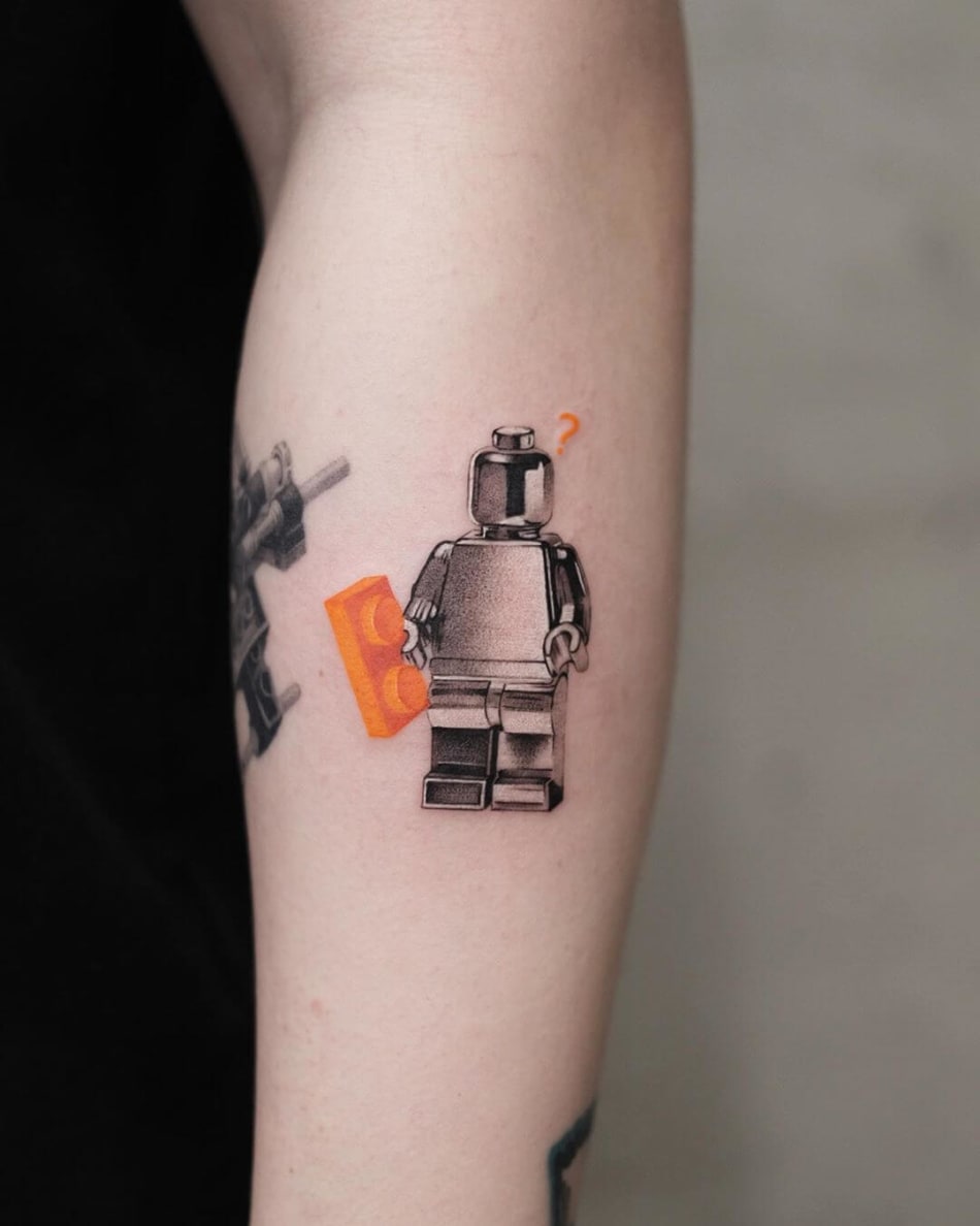 Lego character tattoo by Akiwong