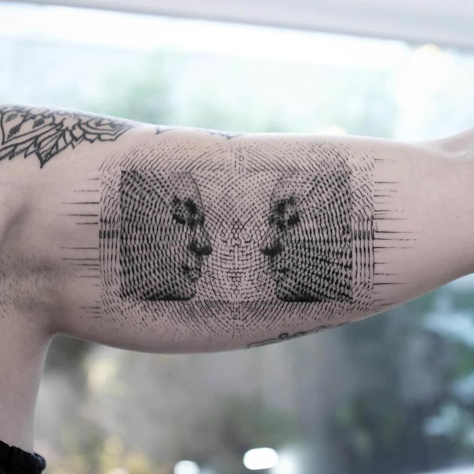 Balazs Bercsenyi facing eachother tattoo