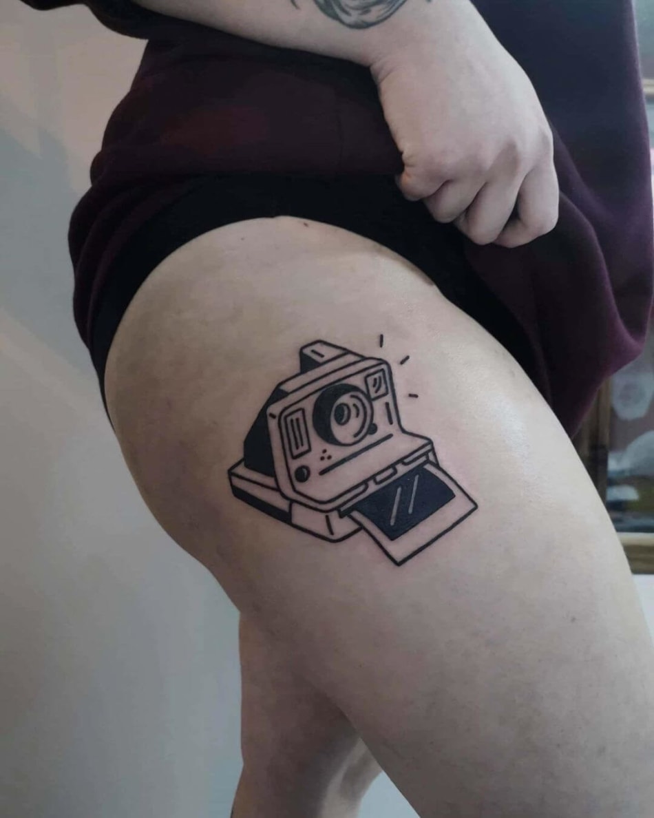 polaroid camera photography bold tattoo by Benjamin Kluk