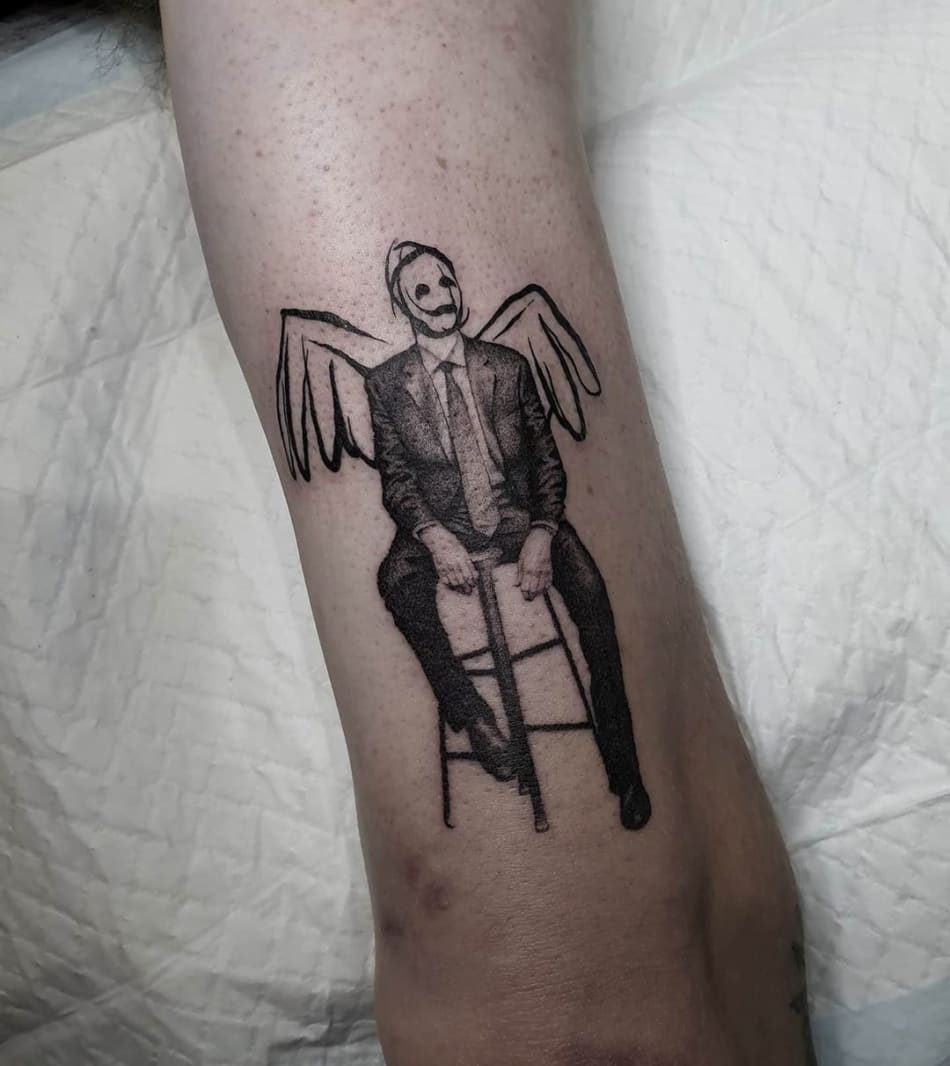 Man with wings sitting on chair tattoo by Breakkytime