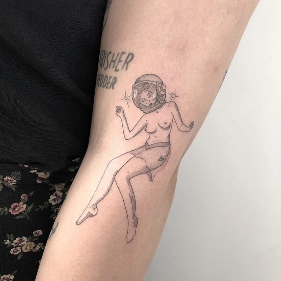 Naked astronaut girl tattoo by Brenda Mena