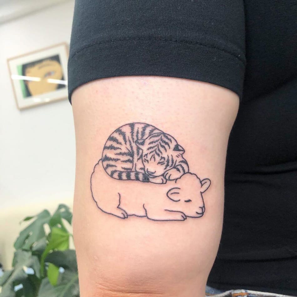 cute tiger sleeping on sheep minimal tattoo by Buoy