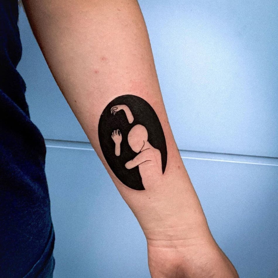 man crawling out of dark circle tattoo by Chloe