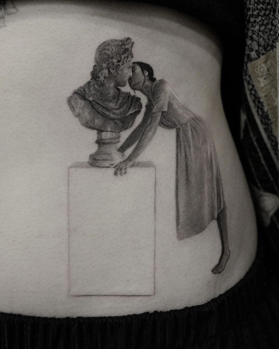 Woman kissing a statue tattoo by Cold Gray